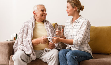 woman and elderly man smiling