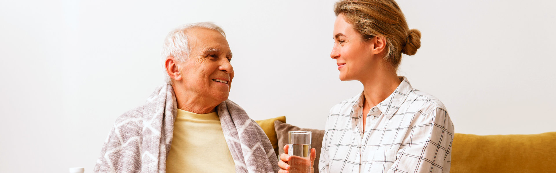 woman and elderly man smiling